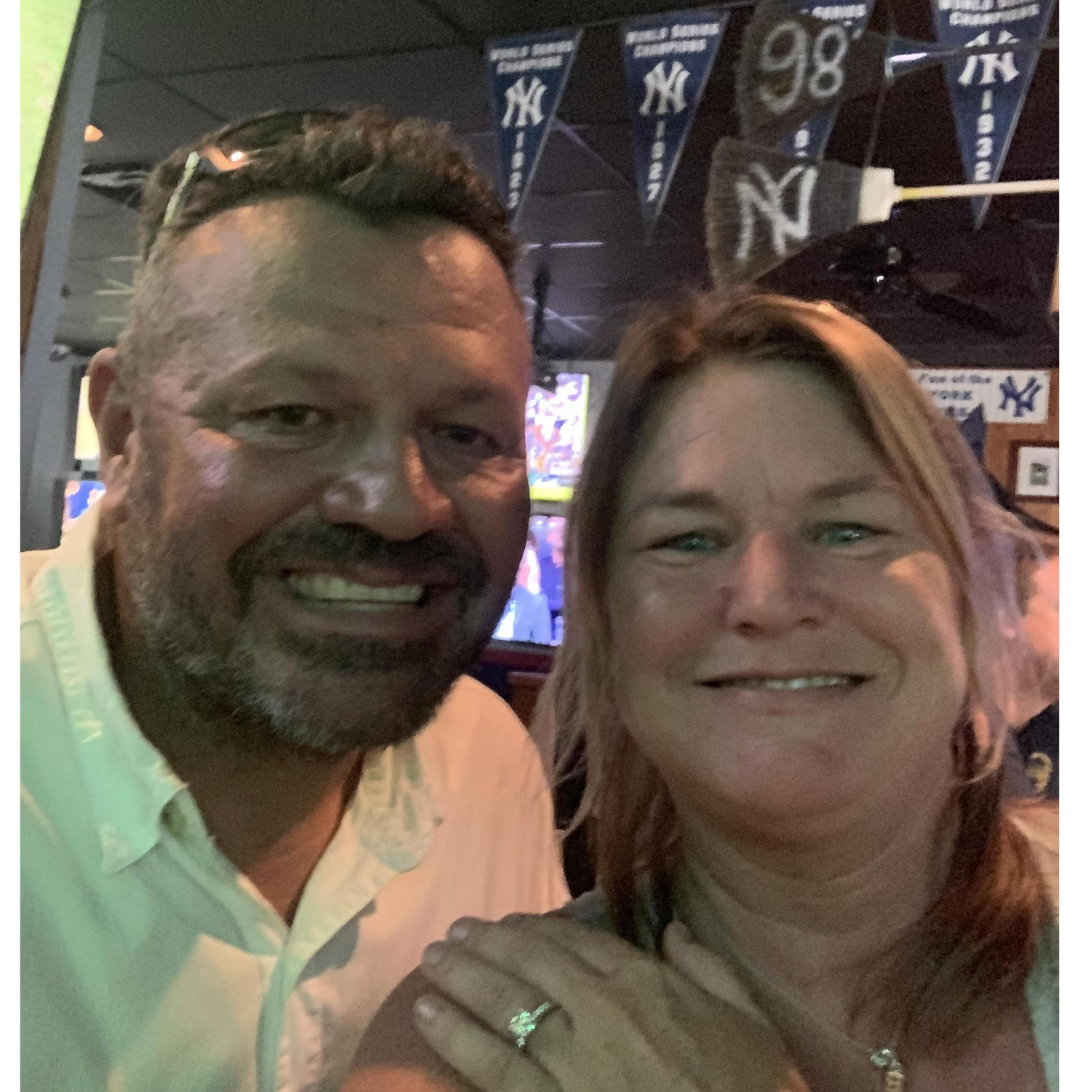 The first picture after we got engaged. Ignore the NY Yankees flags behind us. đ. This is at the Thirsty Turtle (Brianâs favorite). I consider this my first âsacrificeâ for marriage đ