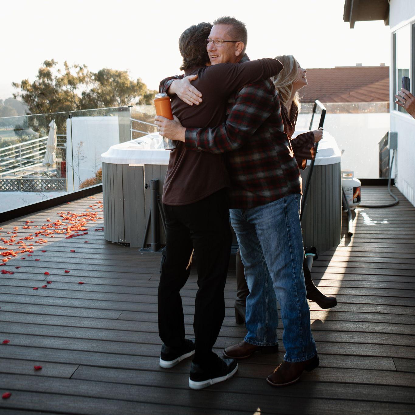 Blake and father in law hugging <3