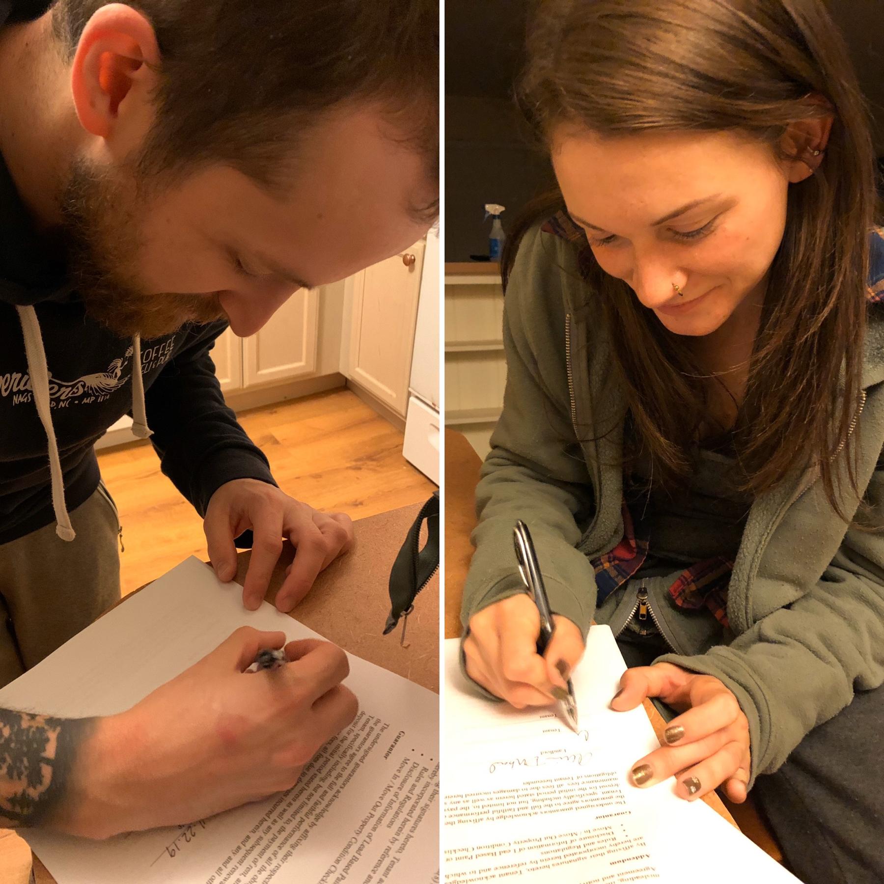 Signing the lease for our first home together!