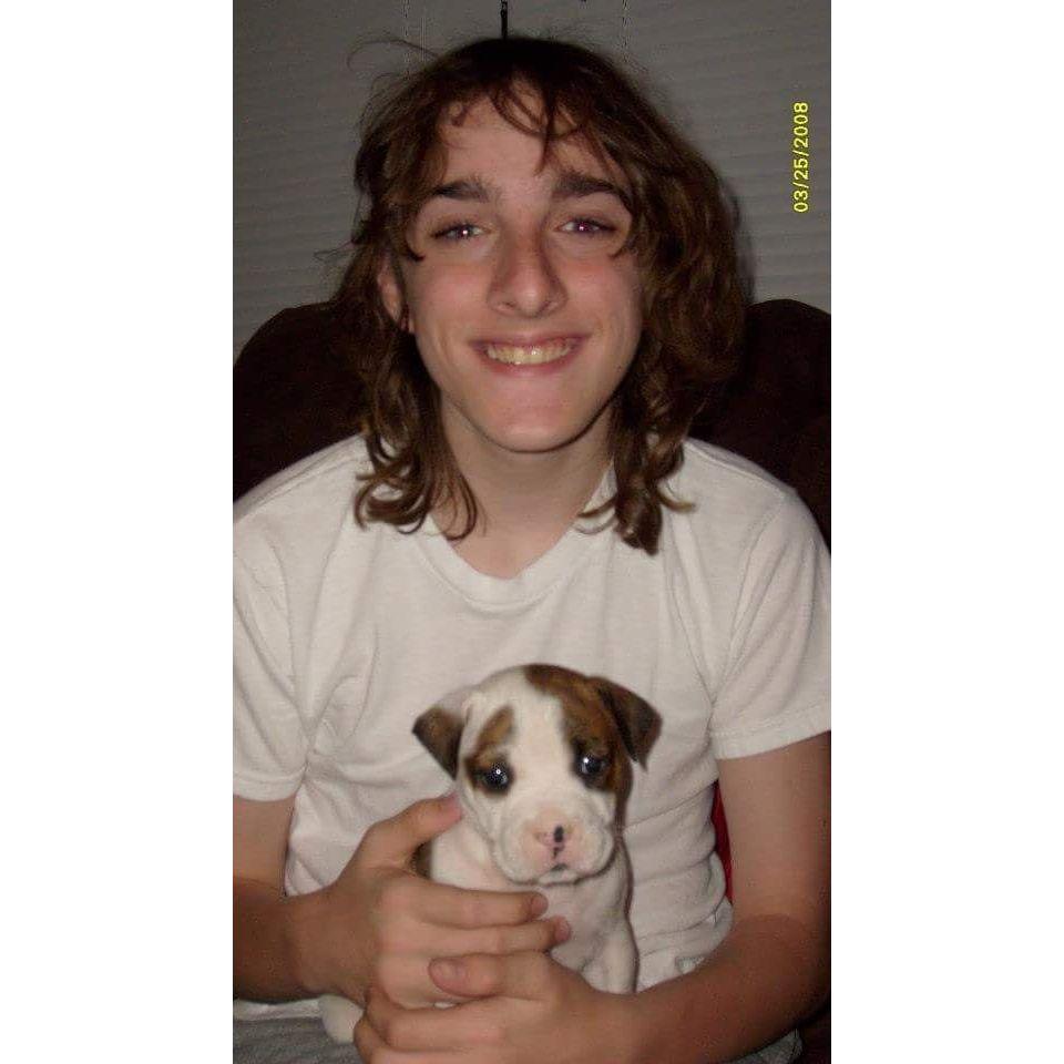 Sean with the baby version of his dog, Bella, 2008