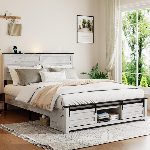 FSTAR Queen Size Wooden Bed Frame with Headboard, Boho Bedframe with Sliding Barn Door Storage Footboard and Charging Station, Solid Wood Slats, No Box Spring Needed, White