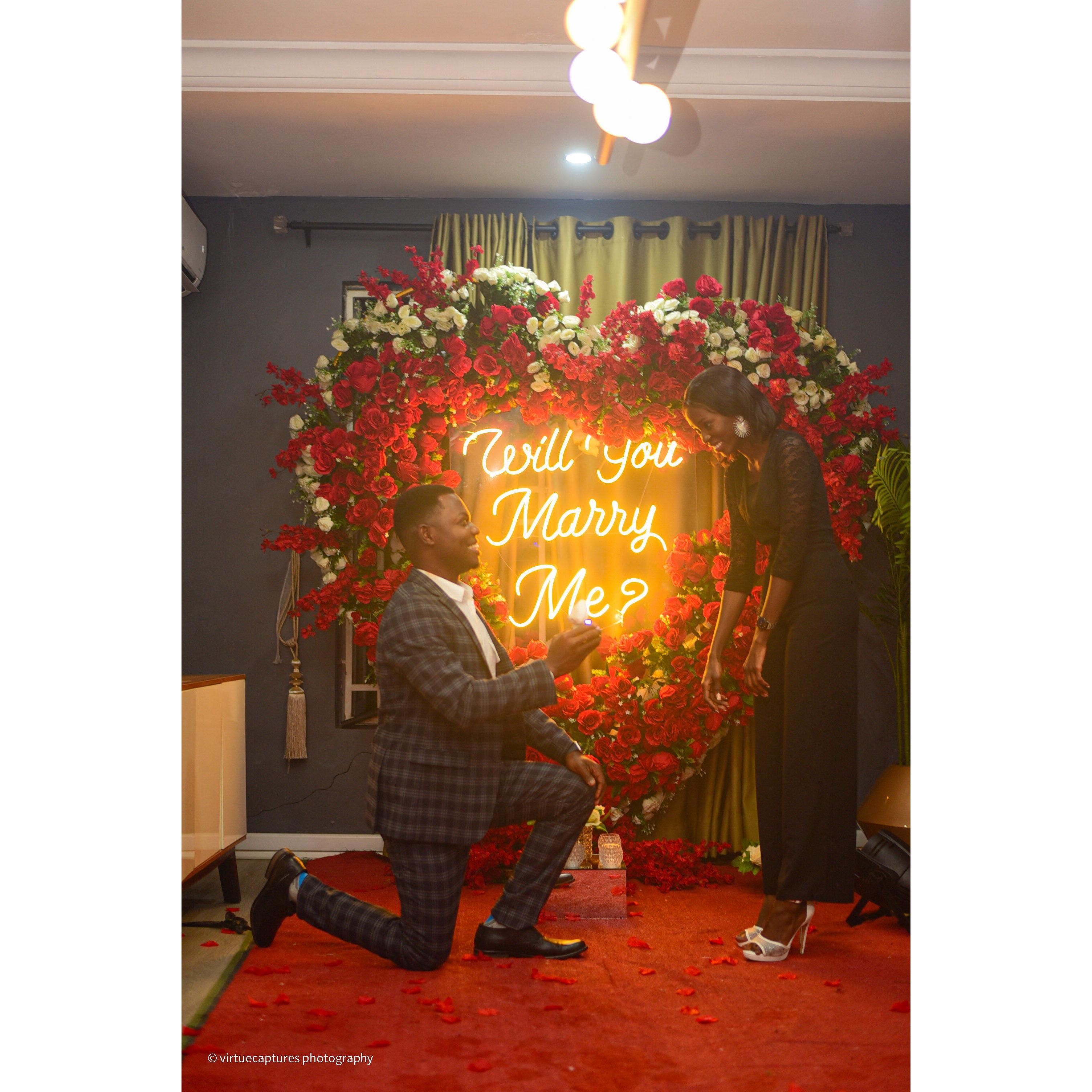 This moment shows when Miracle knelt down to propose, capturing the love, excitement, and the start of our forever together