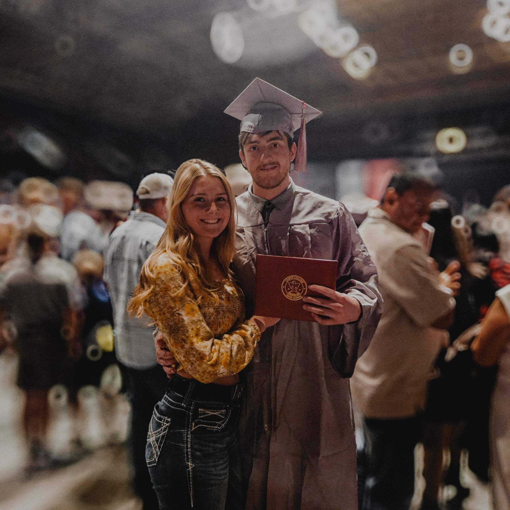 Us at Henry's College graduation in May of 2024