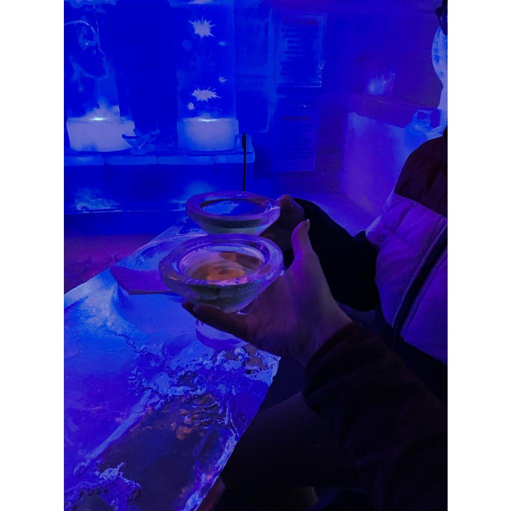 Drinking a martini from a glass made of ice.
