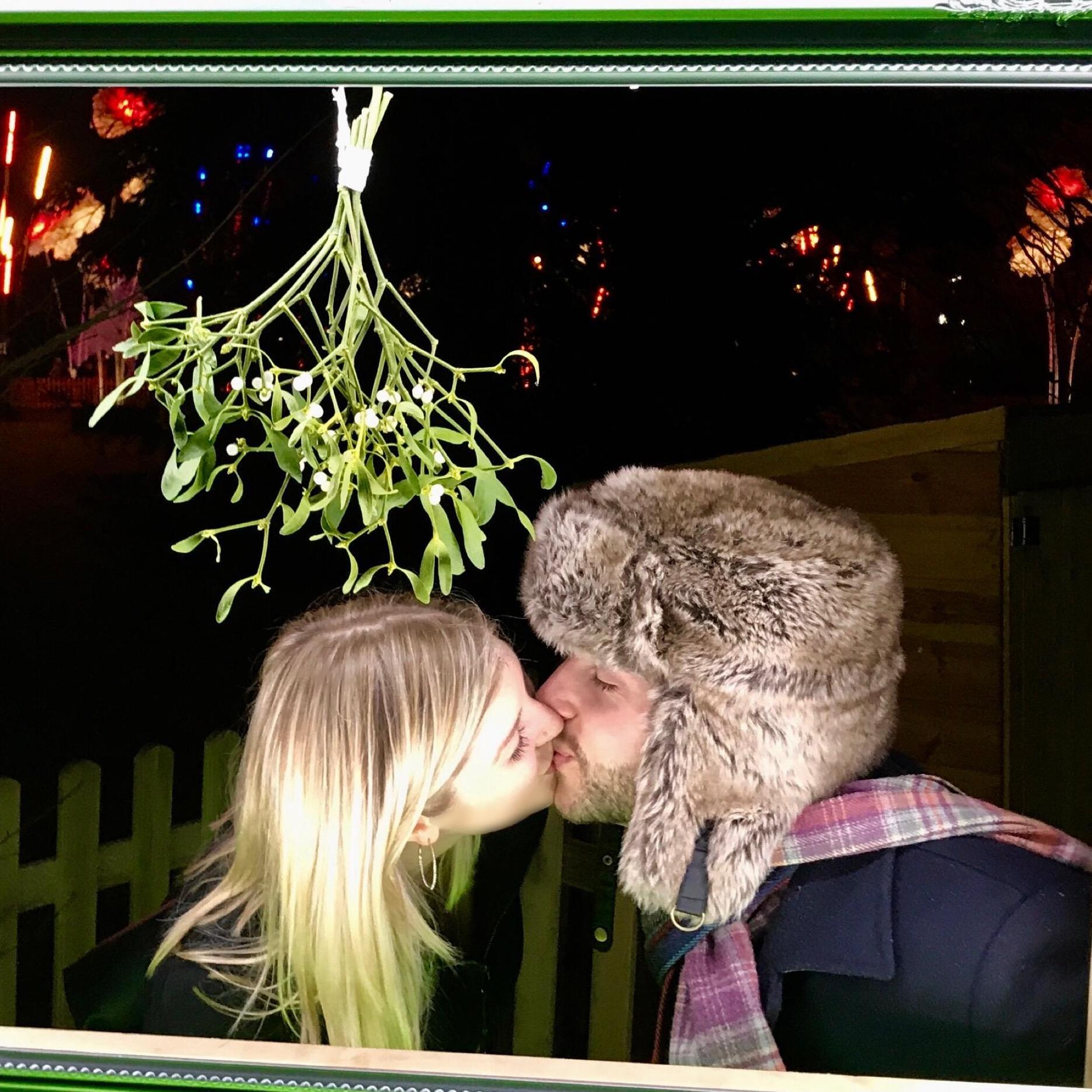 Mistletoe smooch at the Kew Gardens Christmas light show in London
2017