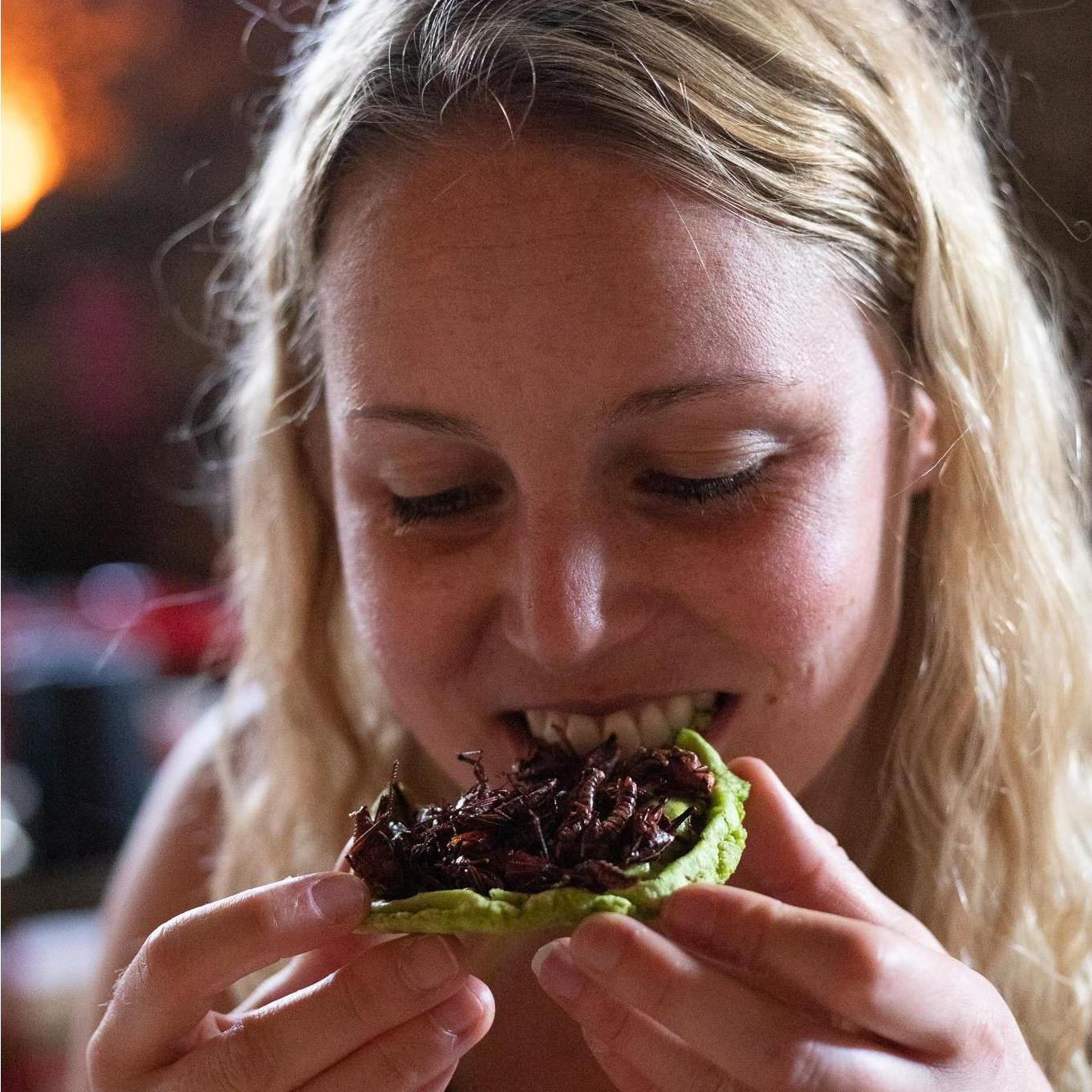 Lindsay eating grasshoppers in Mexico.