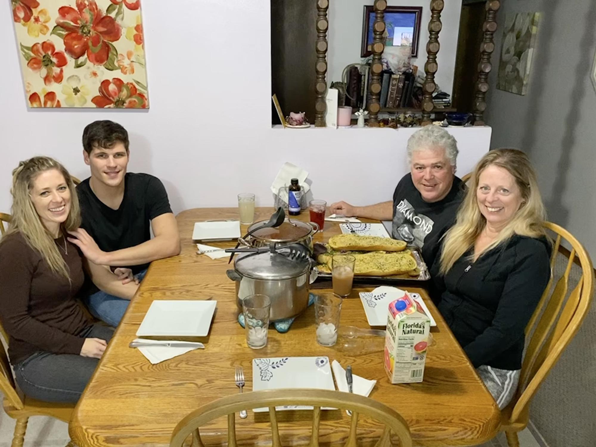 Tanna’s parents with the new couple preparing to devour Brandon’s delicious gourmet spaghetti.