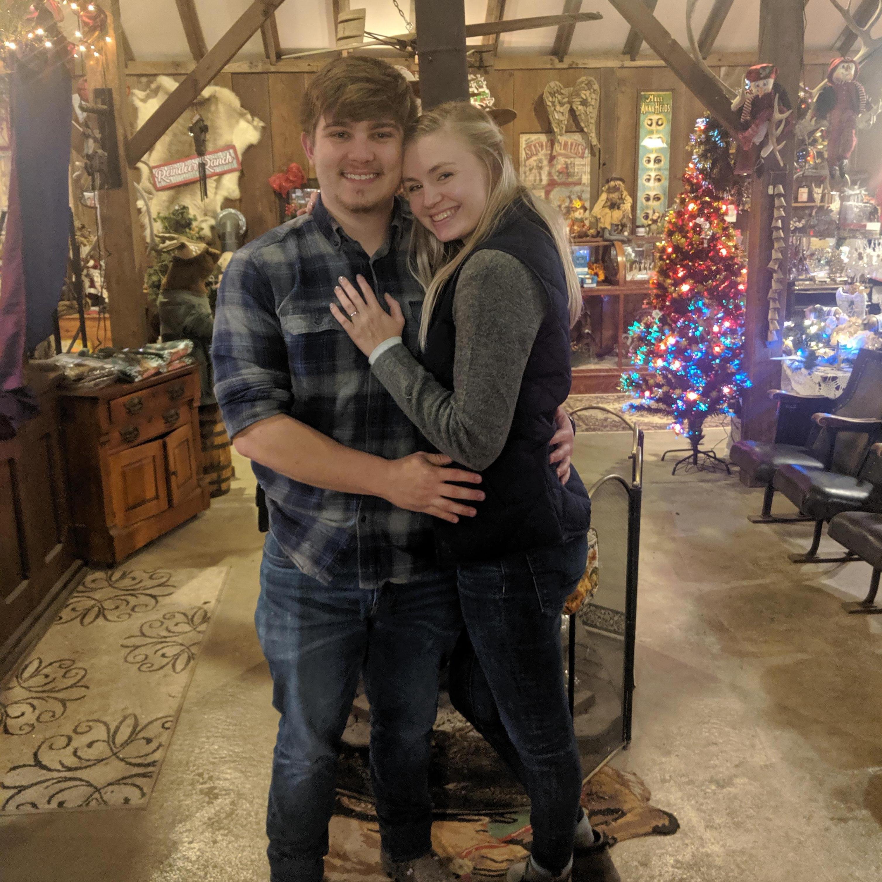 This picture was taken right after we got engaged at the reindeer ranch where we both work!