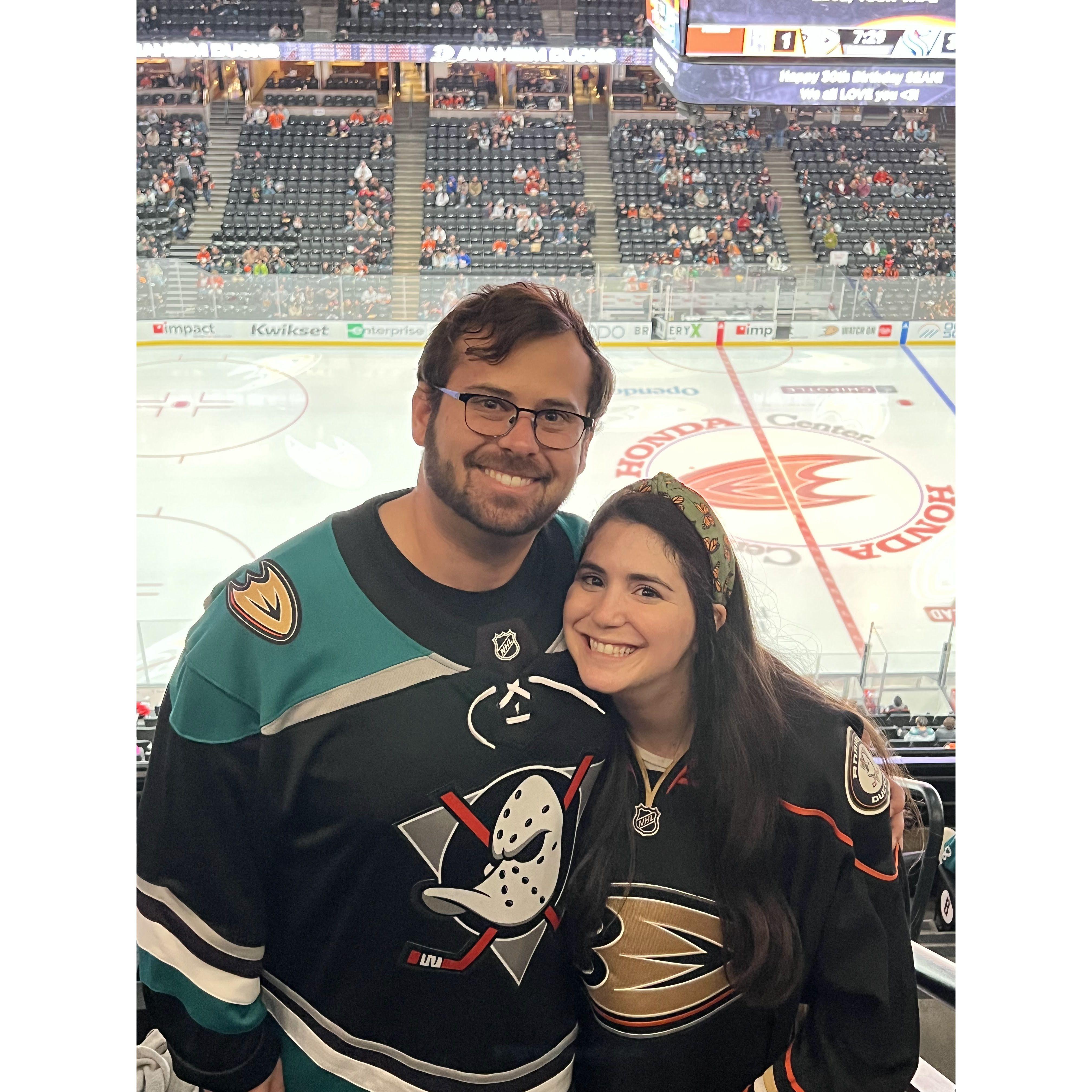 Andrew has successfully turned Bridget into a Ducks fan. After all, ducks fly together!