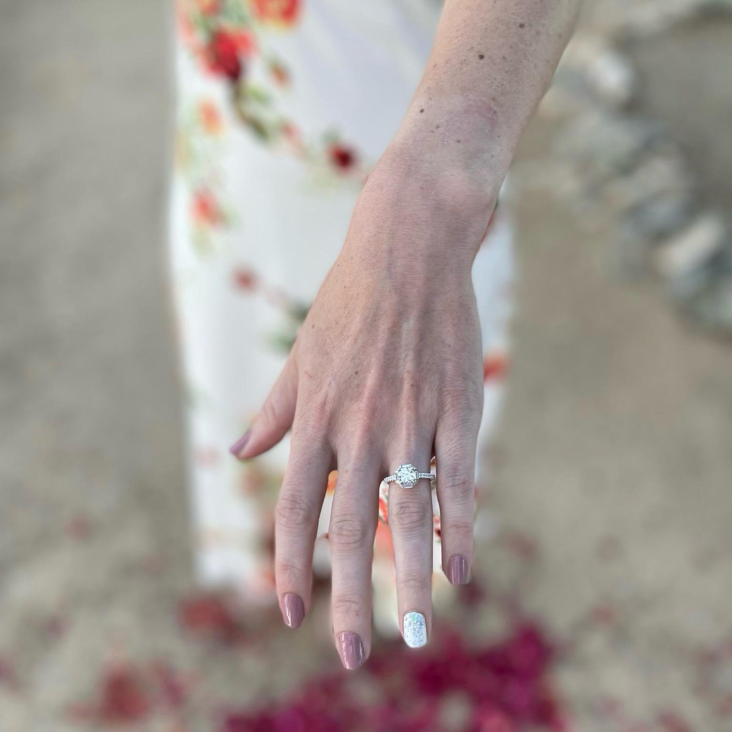Patrick picked out Jen's dream ring and used one of his mom's diamonds as the center stone. It's beautiful!