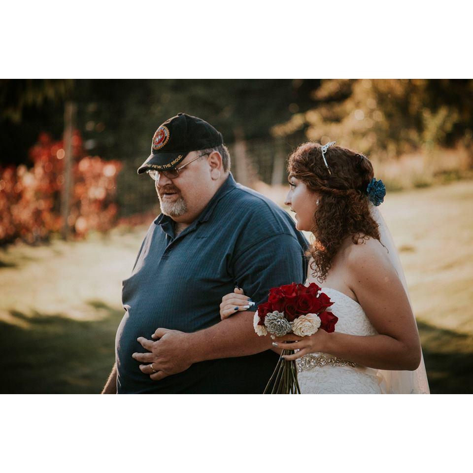 Brides father walking her down the isle 
Photo credit to: A Heart That Beats For One Photography