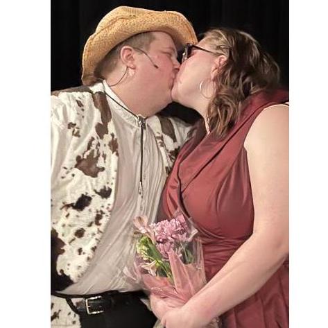 Wendy Jo and Cowboy Bob share a kiss