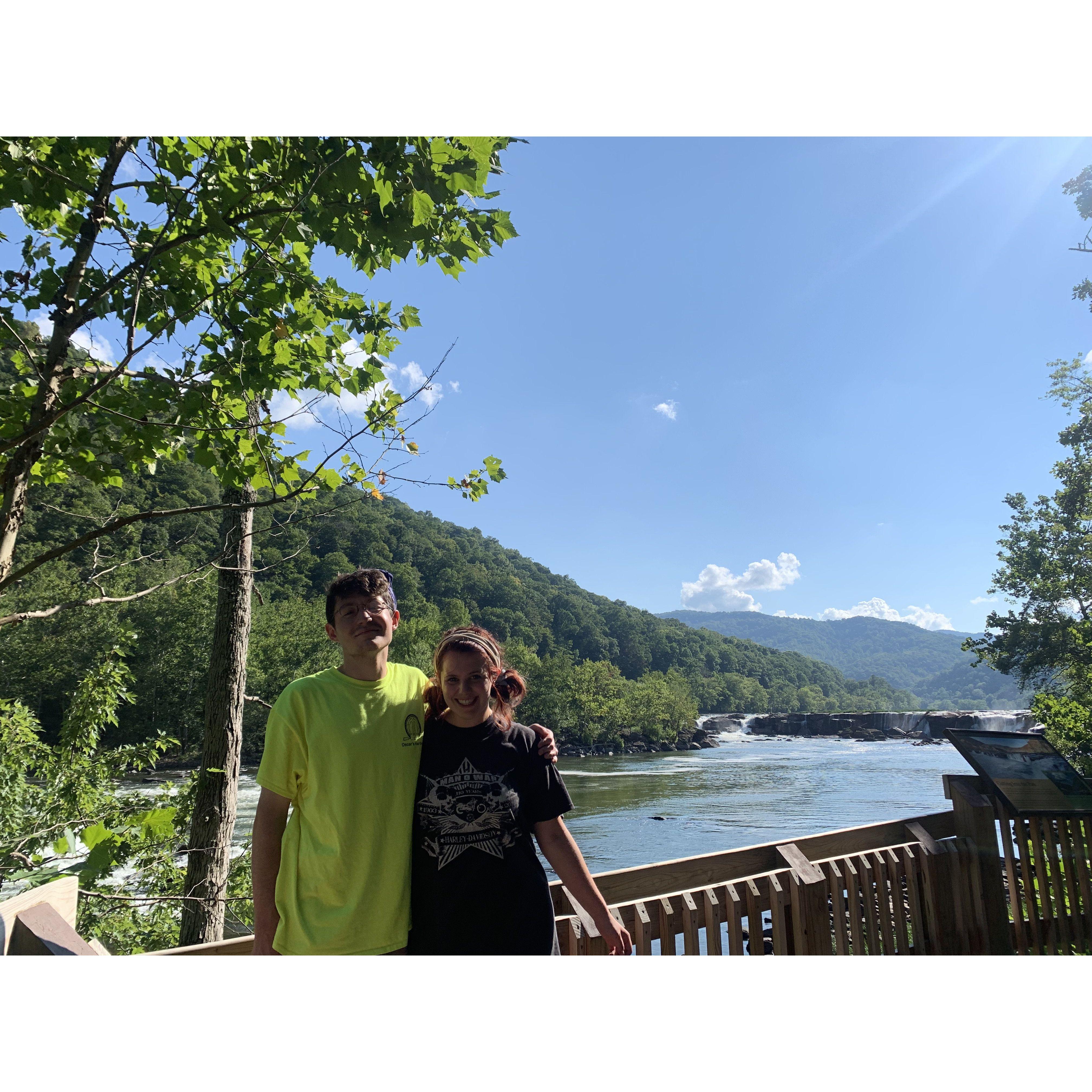 August 2021. We spent the weekend at New River Gorge in West Virginia. We hiked the Gorge, and swam at Sandstorm Falls. It was our first big trip together after college, and it was a blast!