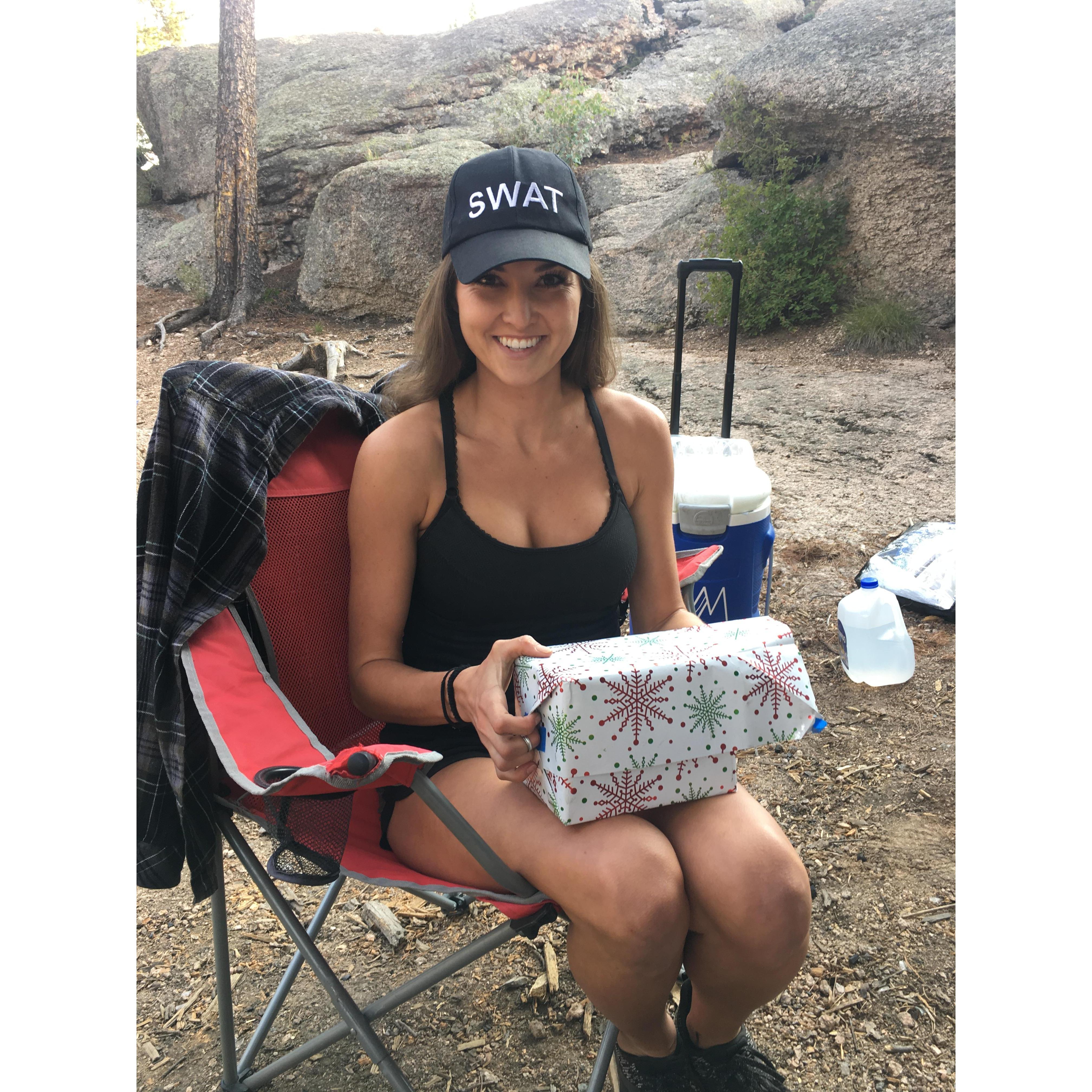Brittney opening the time capsule on the engagement camping trip!