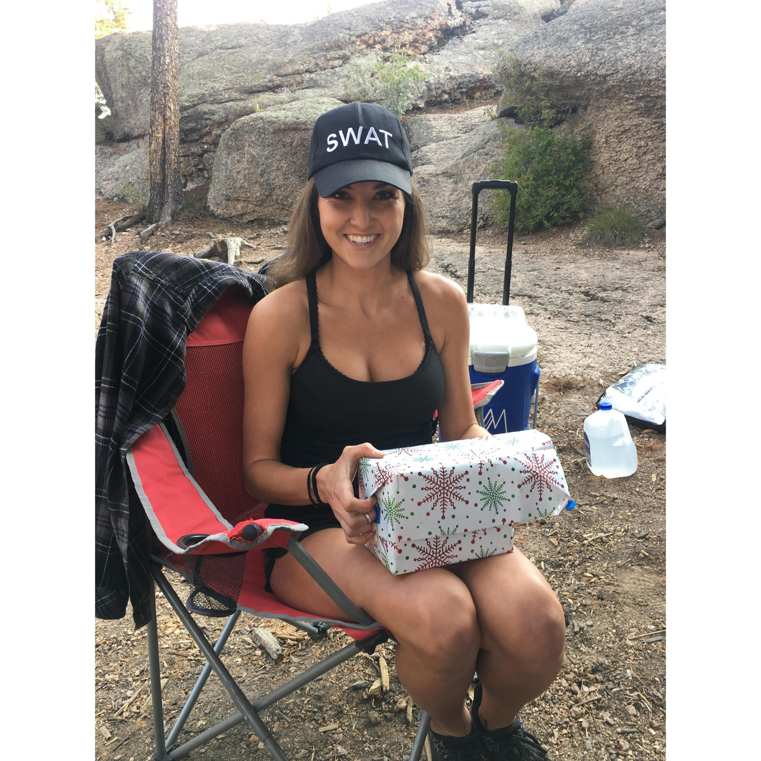 Brittney opening the time capsule on the engagement camping trip!