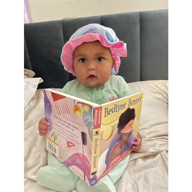 Great grand daughter, Mille LaKay, already likes books!  That makes her great grand parents very happy.