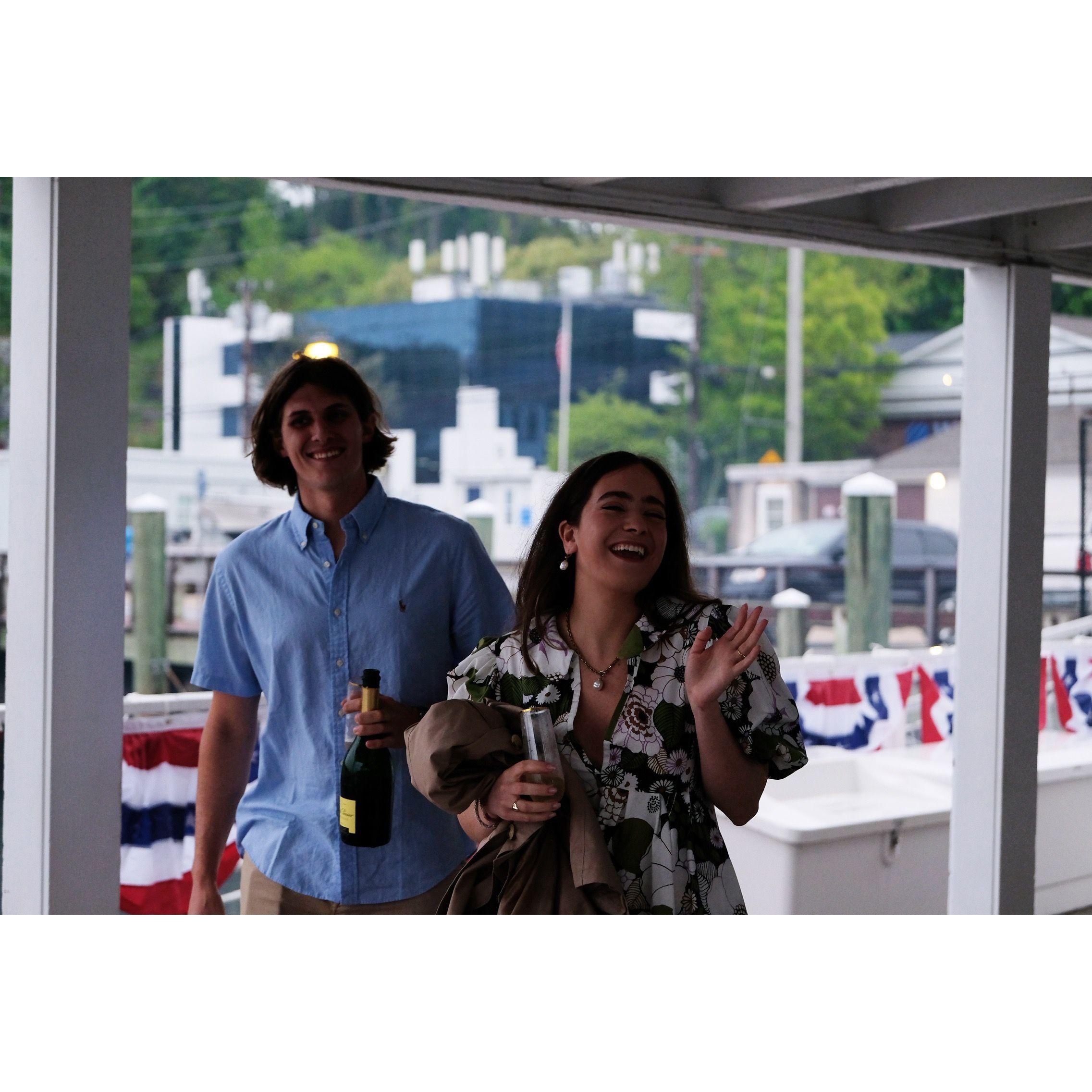 John proposed at his boat and our friends Courtney and Tom were taking photos and videos nearby.
