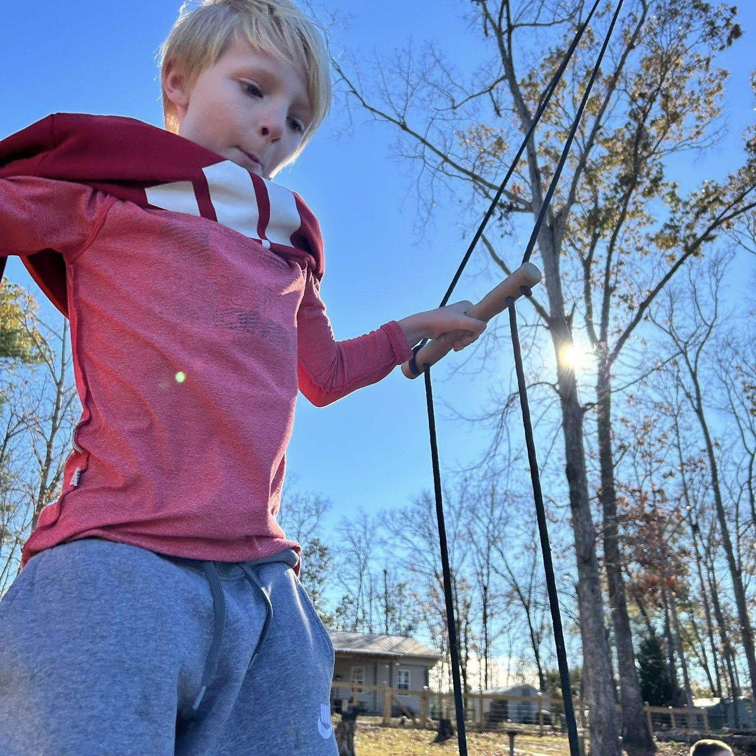Lee swinging on a rope swing, this was the first visit with the boys out to their new Uncle Steve's cabin.