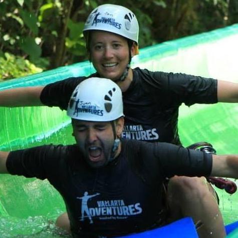 The end of our zip lining tour with a water slide!