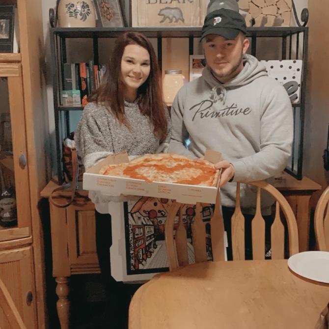 Our very first photo together, with our heart shaped pizza🍕 2021