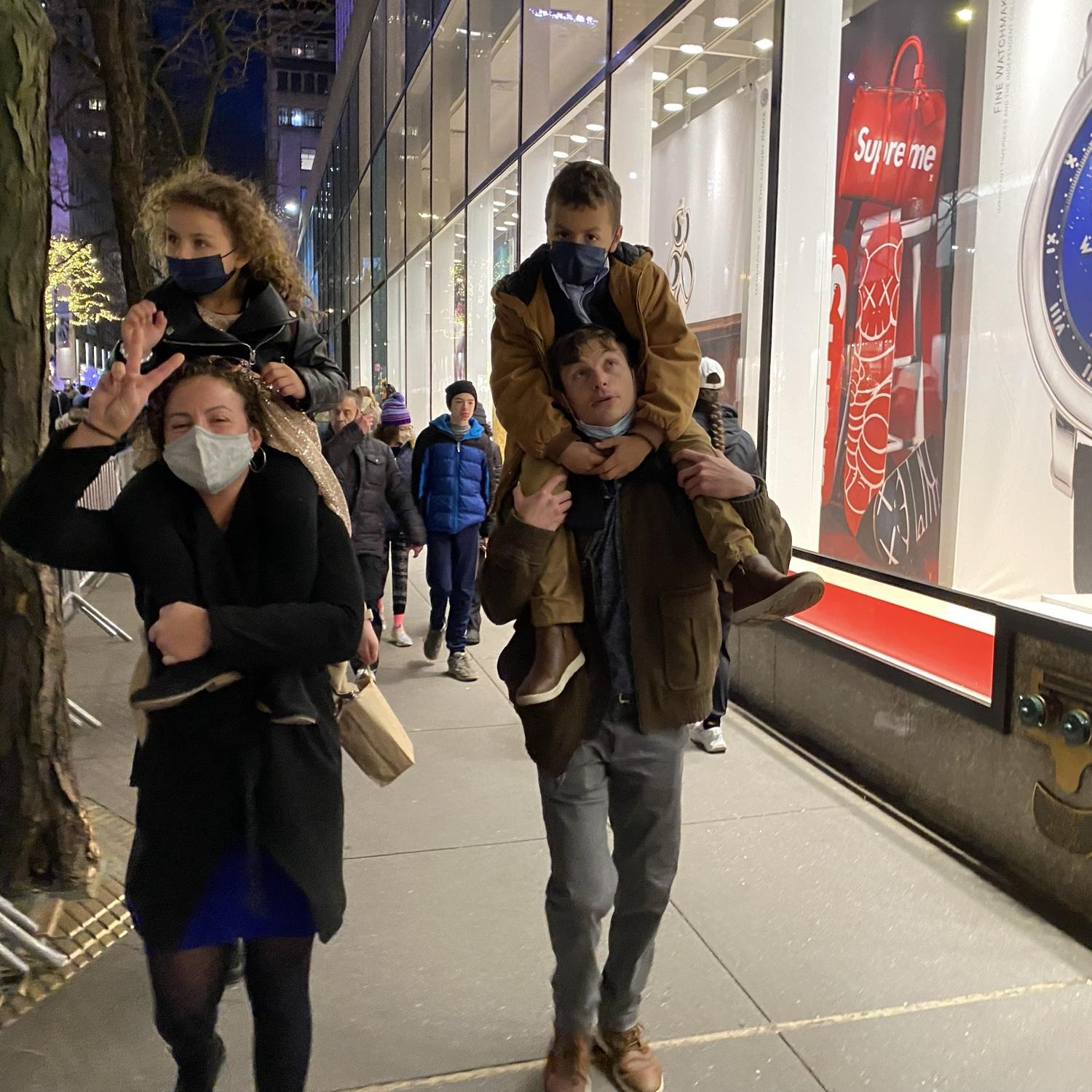 12/12/21 Brendon with Jacob & Dacia with Alana walking by Rockefeller Center during a birthday celebration day for Alana.