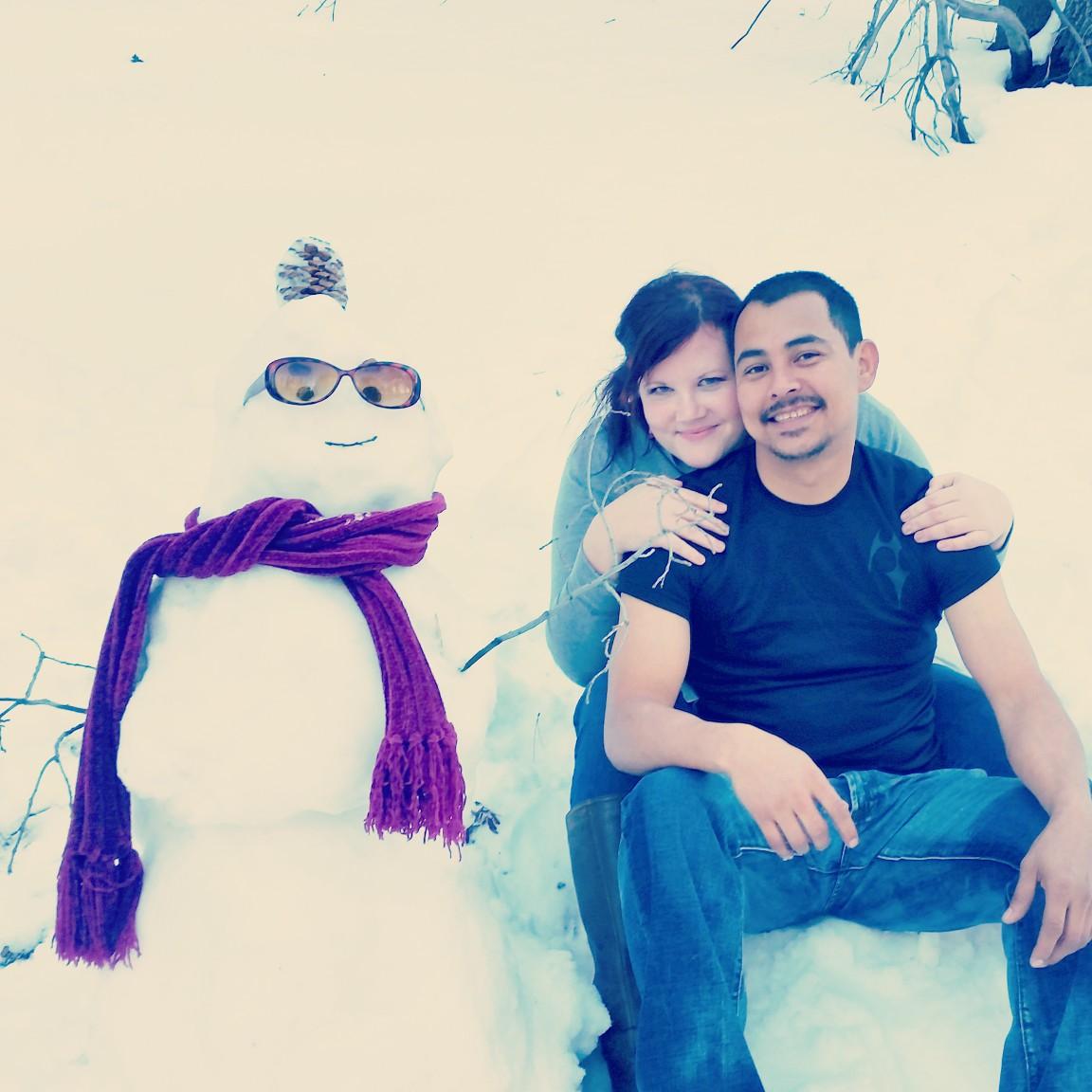 Luis's first snow man. Katie's 317th snow man. ;)