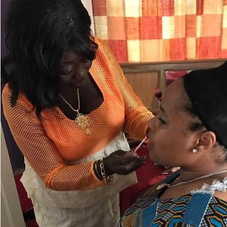Mama Gloria helps Joré get ready to be a bride.