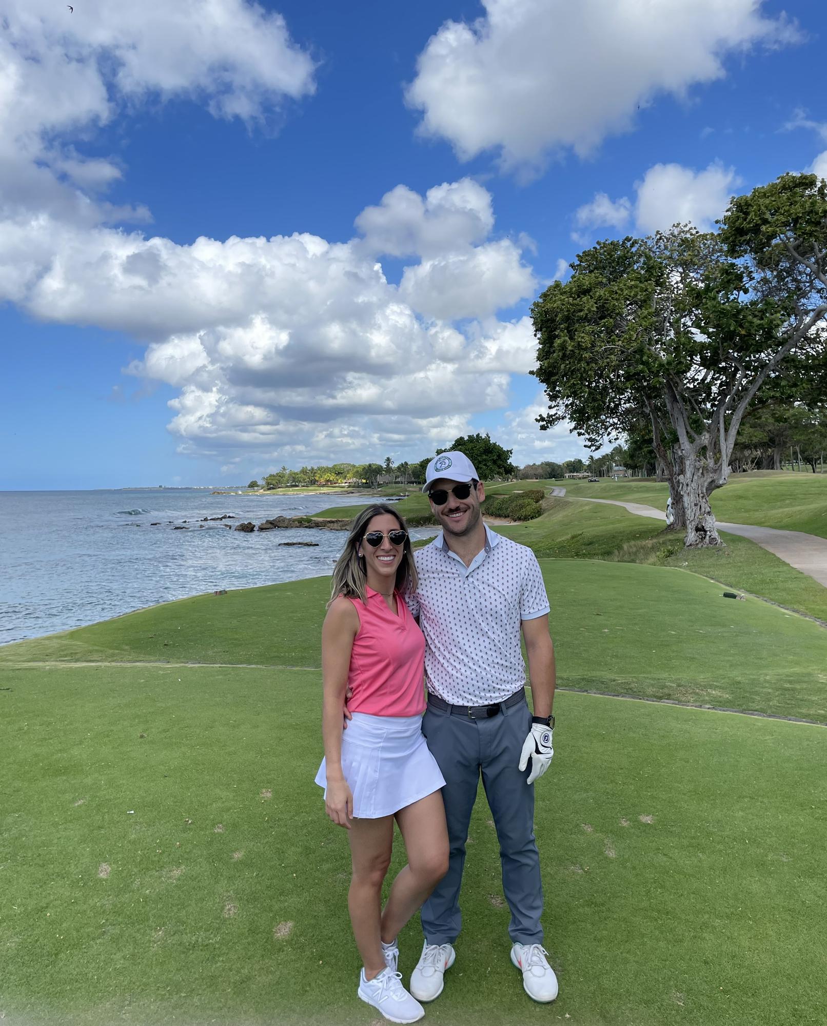 Ryan teaching Nina to golf