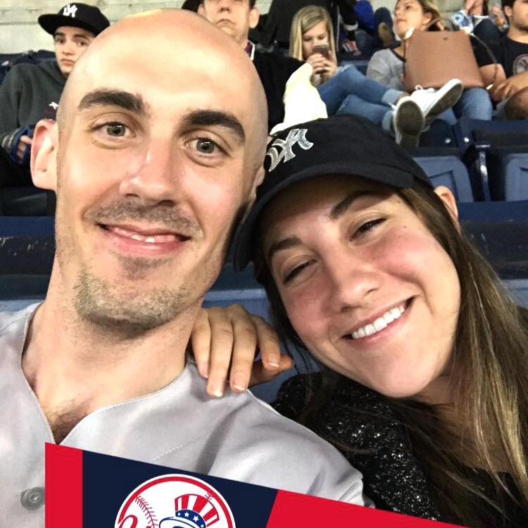 Rob taking Callie out to the ball game. Rob is a Yankee fan. Callie wears the hat ironically.