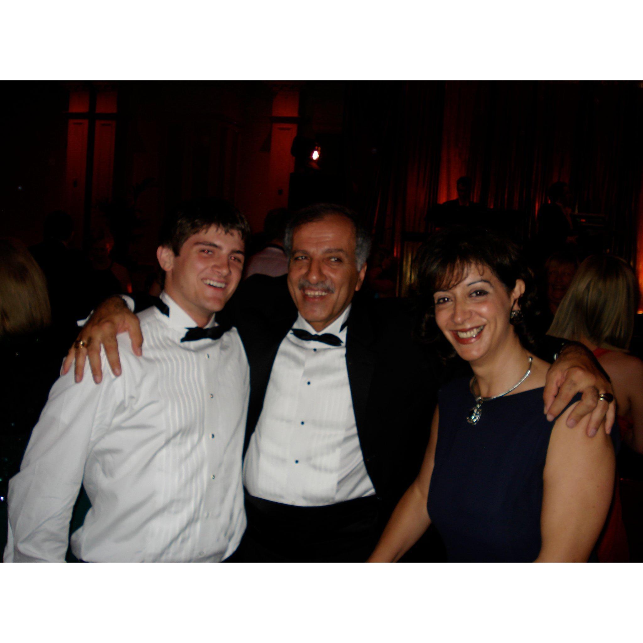 Groomsman Max with the groom's parents way back in 2006 - he's been referred to as "son" by them ever since