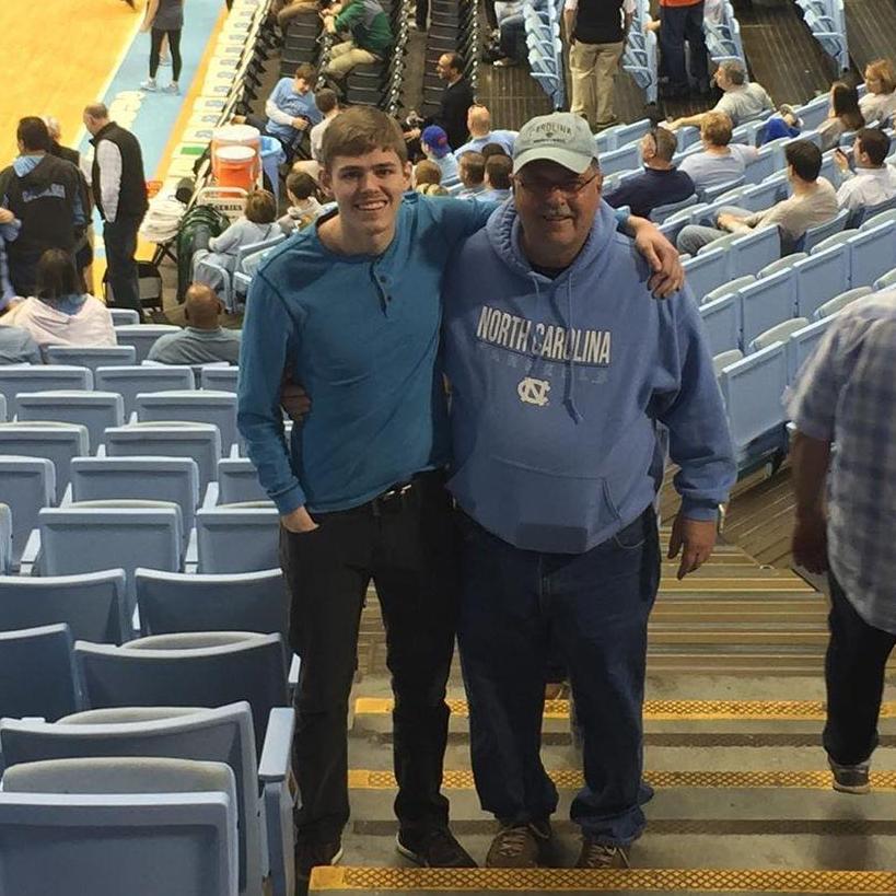 Casey cheering on the Tarheels with his dad, Ronnie.