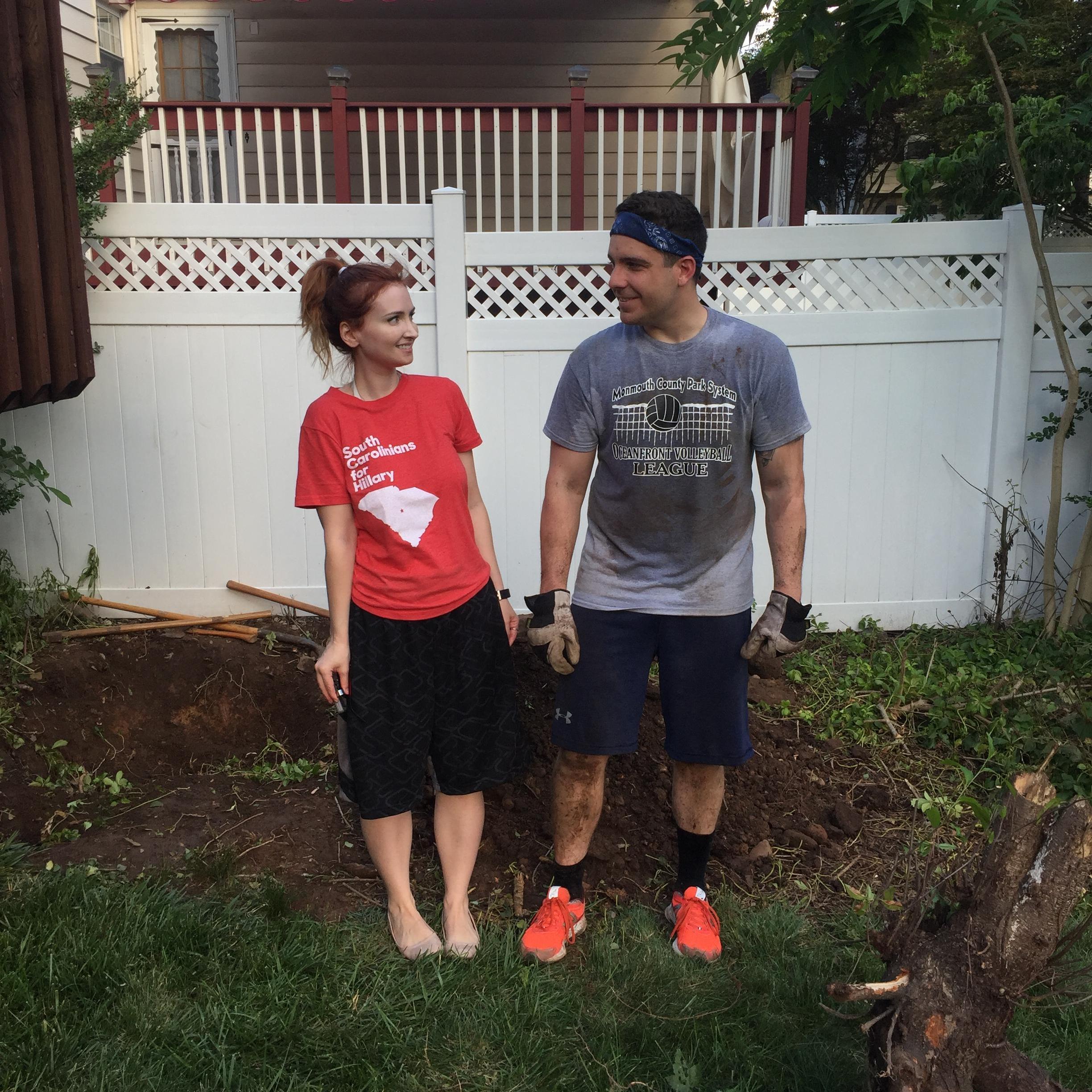 Matt enjoying yard work in their new home and Lucinda admiring him.