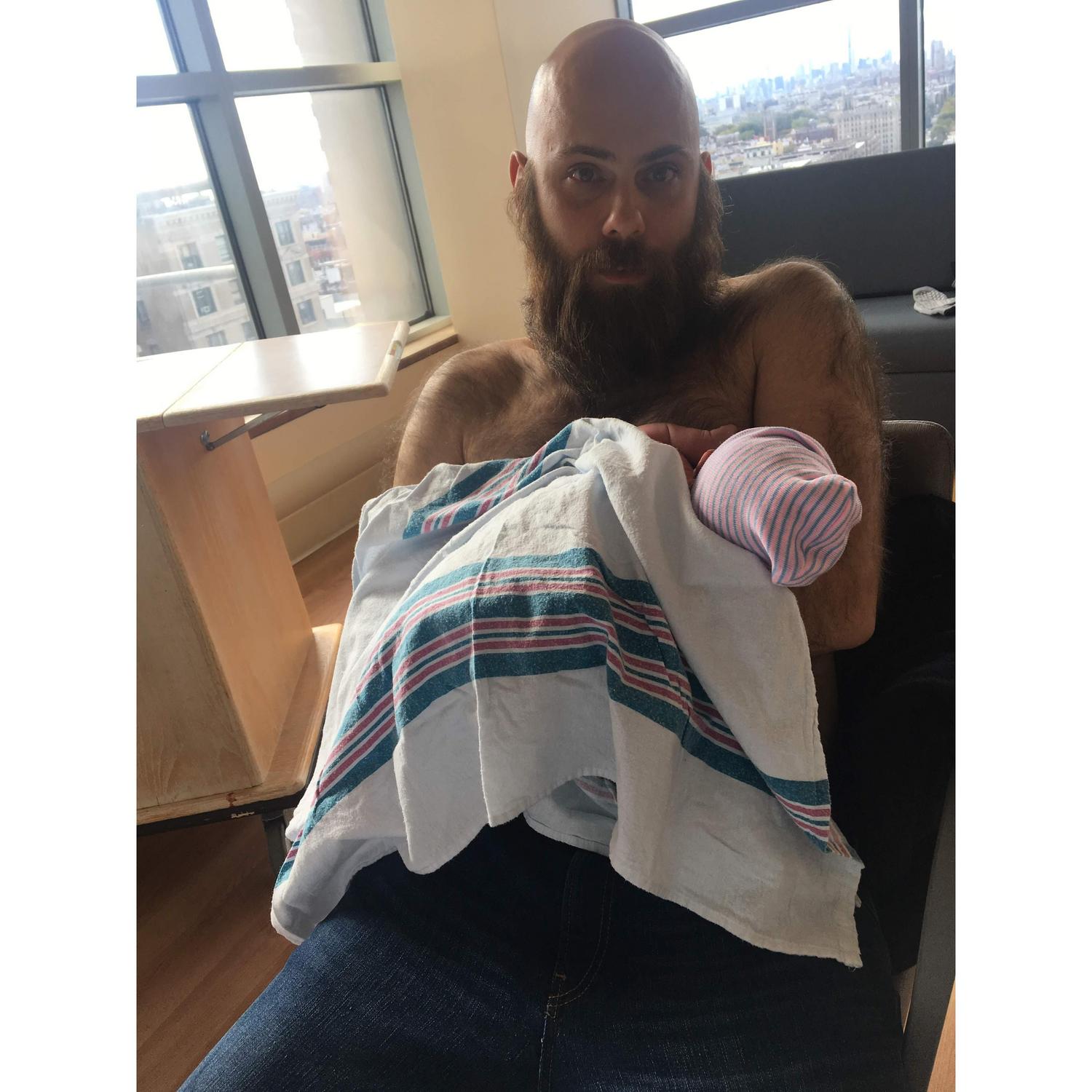 Daddy's skin to skin with Asante.