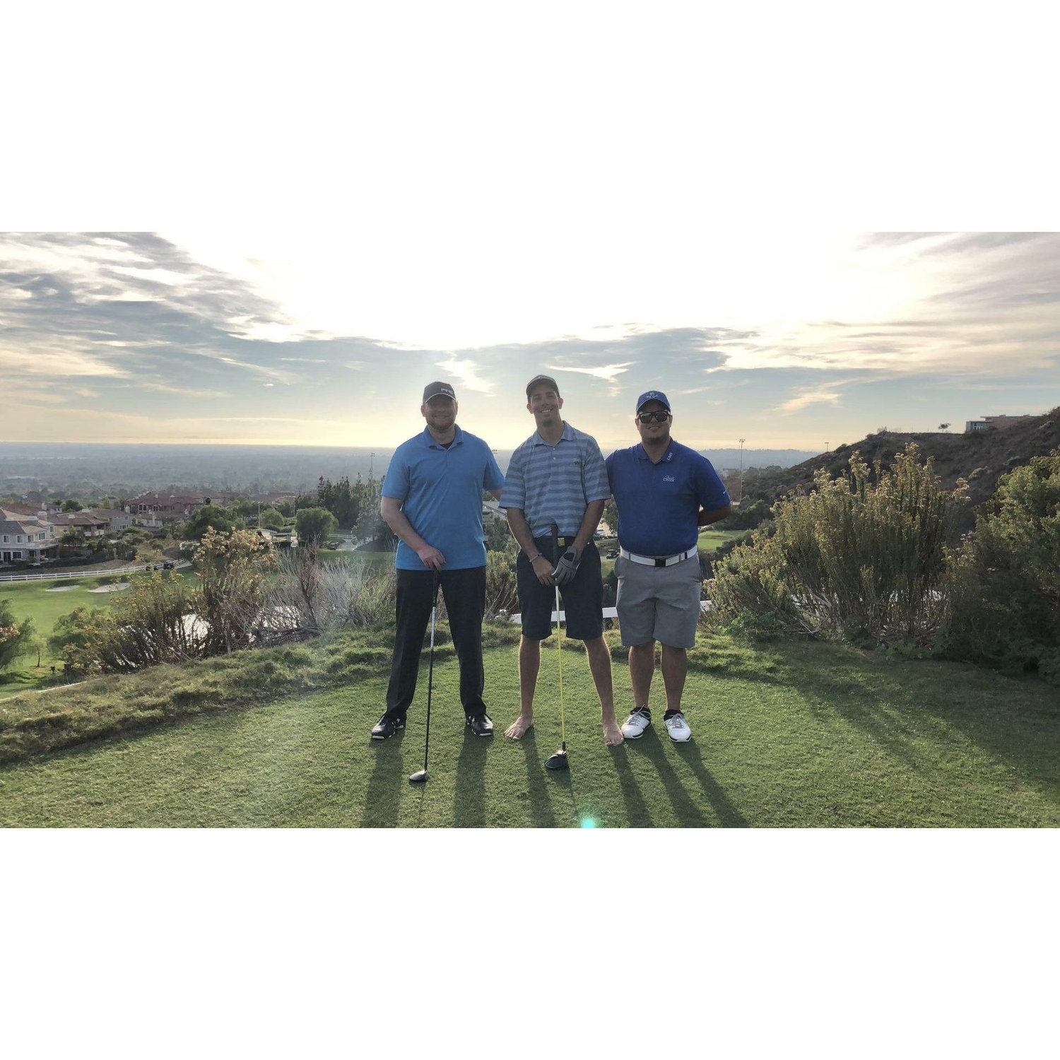 Todd, Kevin (groomsman), and Casey playing golf at Black Gold 2018