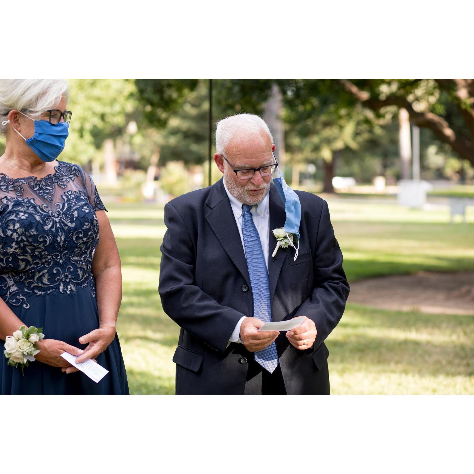 Rachel's father, Mike, reading one of the Seven Blessings, mid ceremony