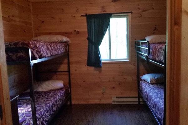 Bedroom in cabin set up with bunk beds
