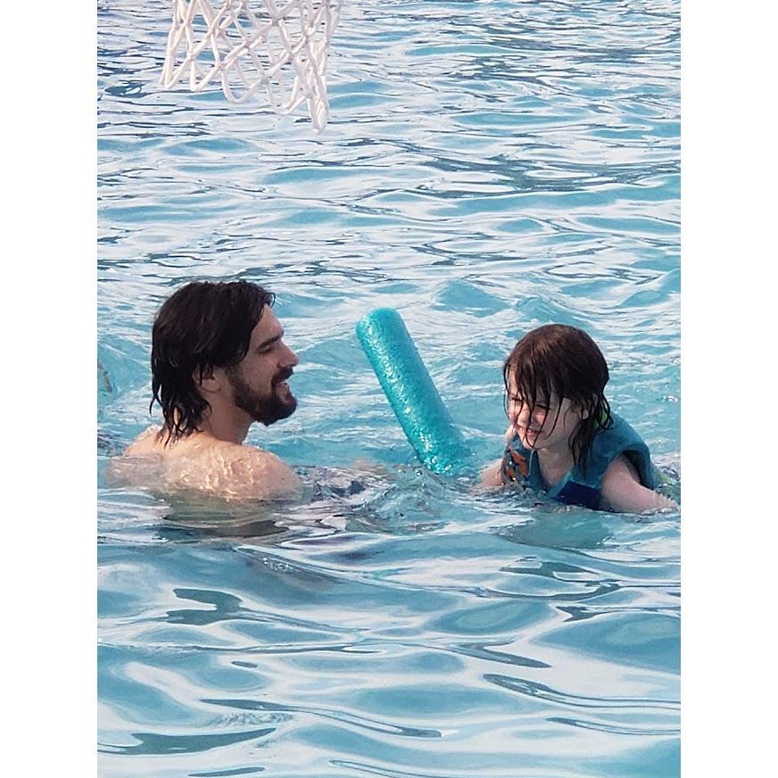 Brian Teaching Liam to swim.
