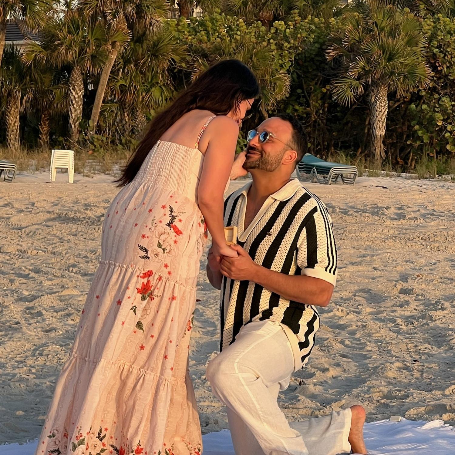 Sam proposing on Vanderbilt Beach in Naples, FL… Lauren said yes!