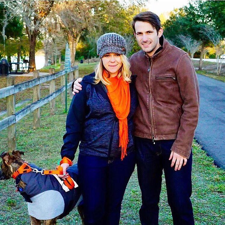 One of our first pictures with the newest member of the family, our ex-racer, Riker (of course, he doesn't like posing for pictures)
