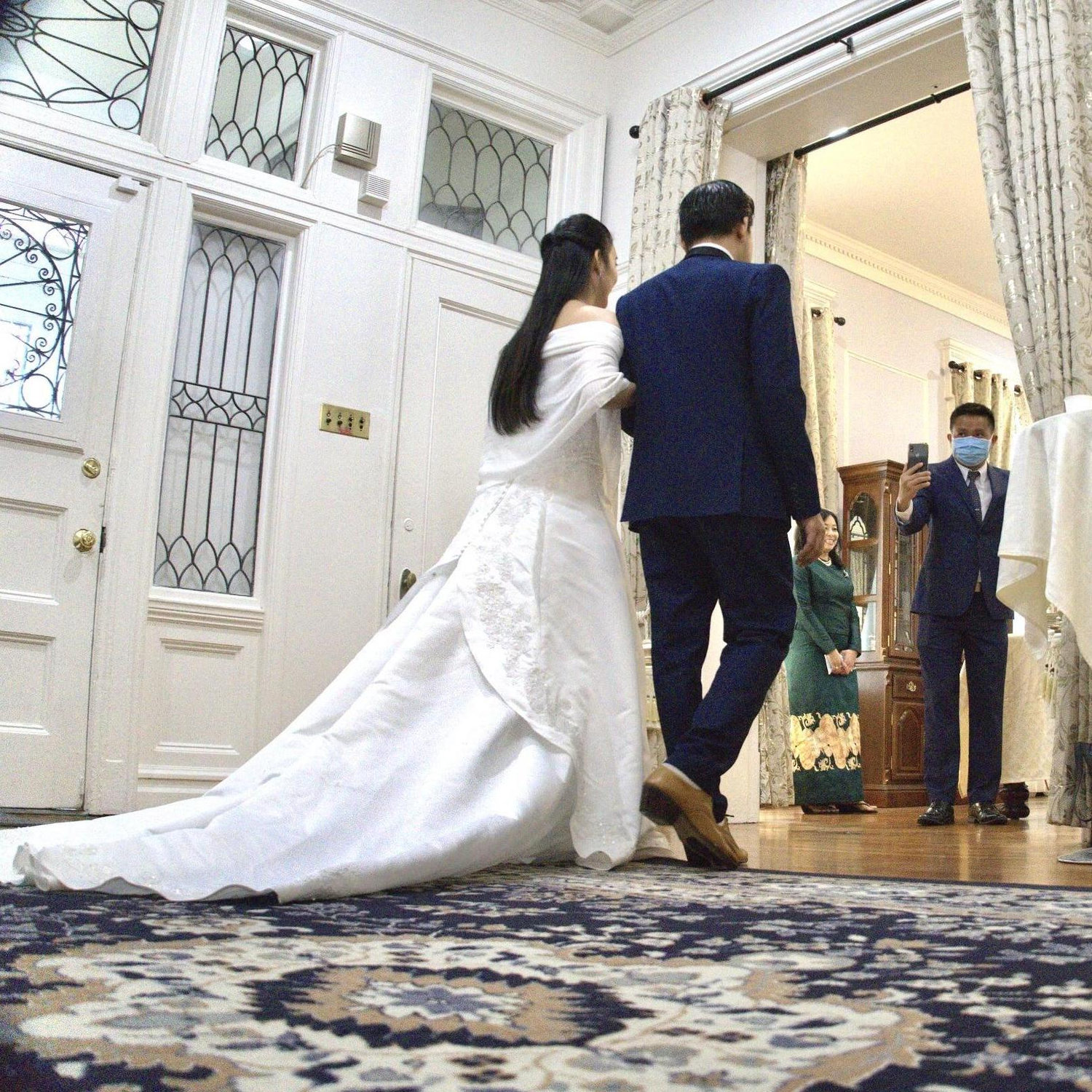 Bride and groom entering their wedding venue.
