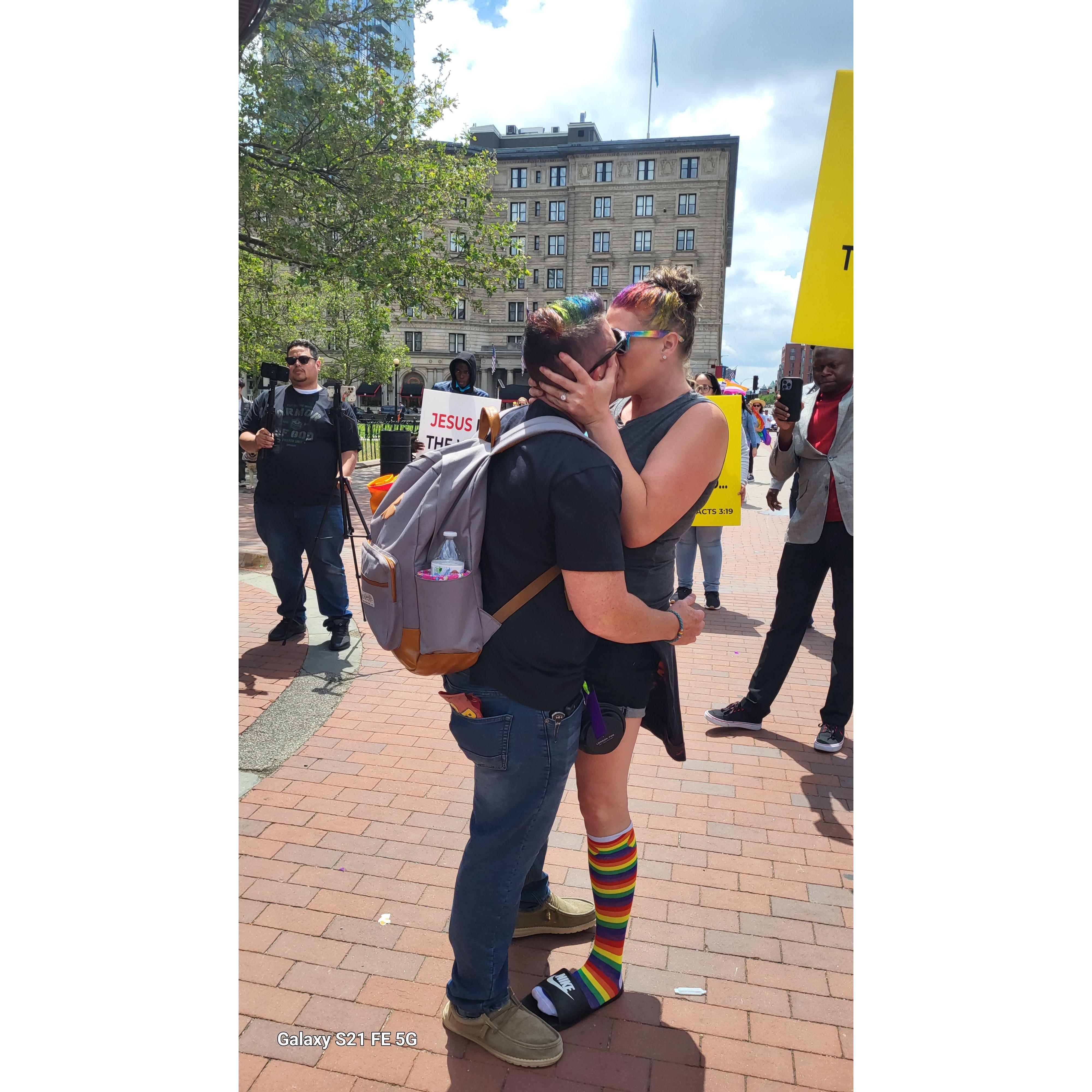 The couple's first Pride Parade together in Boston, MA June 2022, protesting the counter protestors in an act of courageous love.