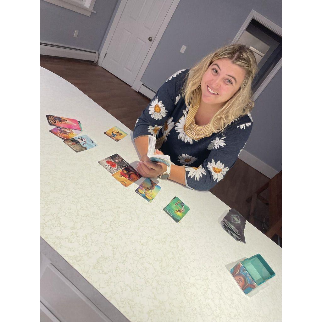 September 2022. AJ reading Tarot in our new house in Rhode Island during the walk-through. "The spirits say it's going to be great and no ghosts!"