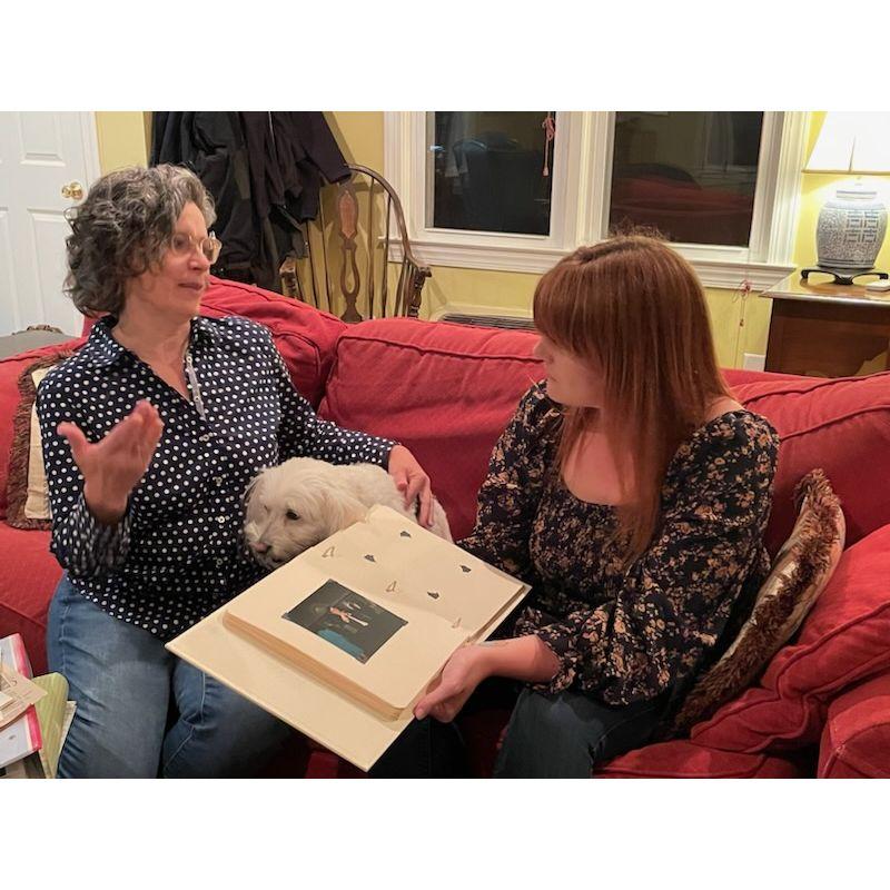Abby and Anne going through Jack's baby pictures