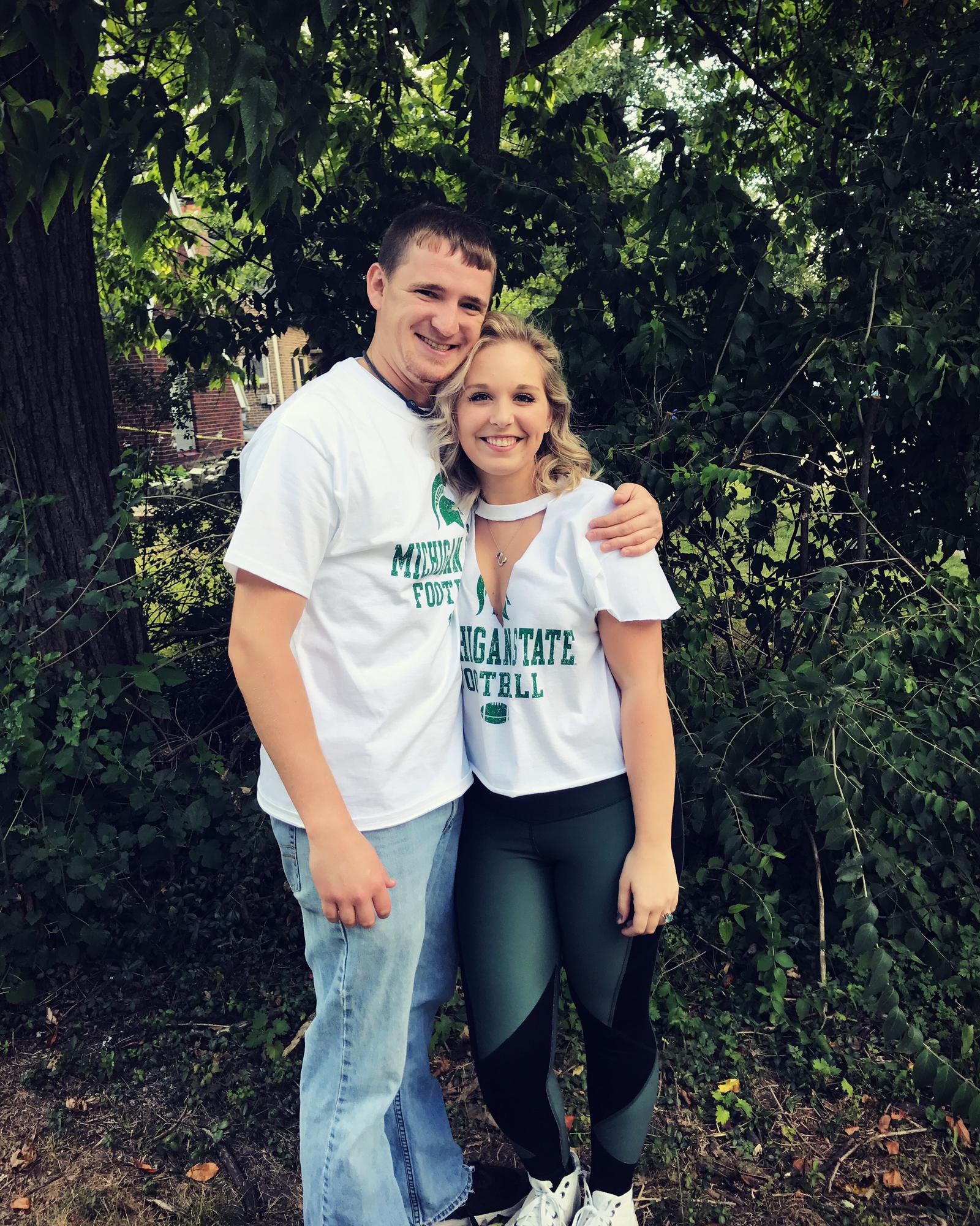 Go green! We look like children. Our first MSU game together