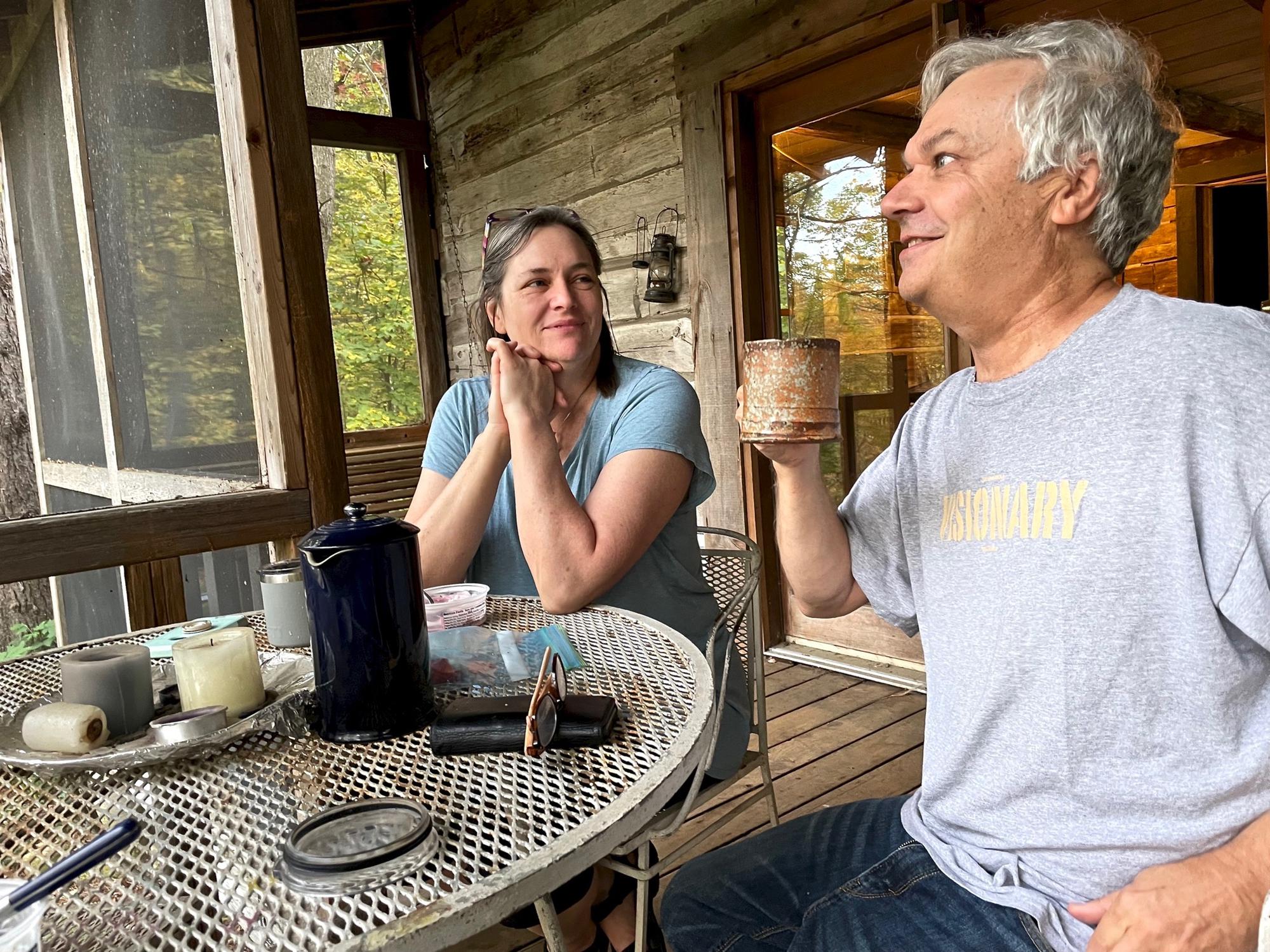 Discussing cabin ideas over breakfast at a cabin.