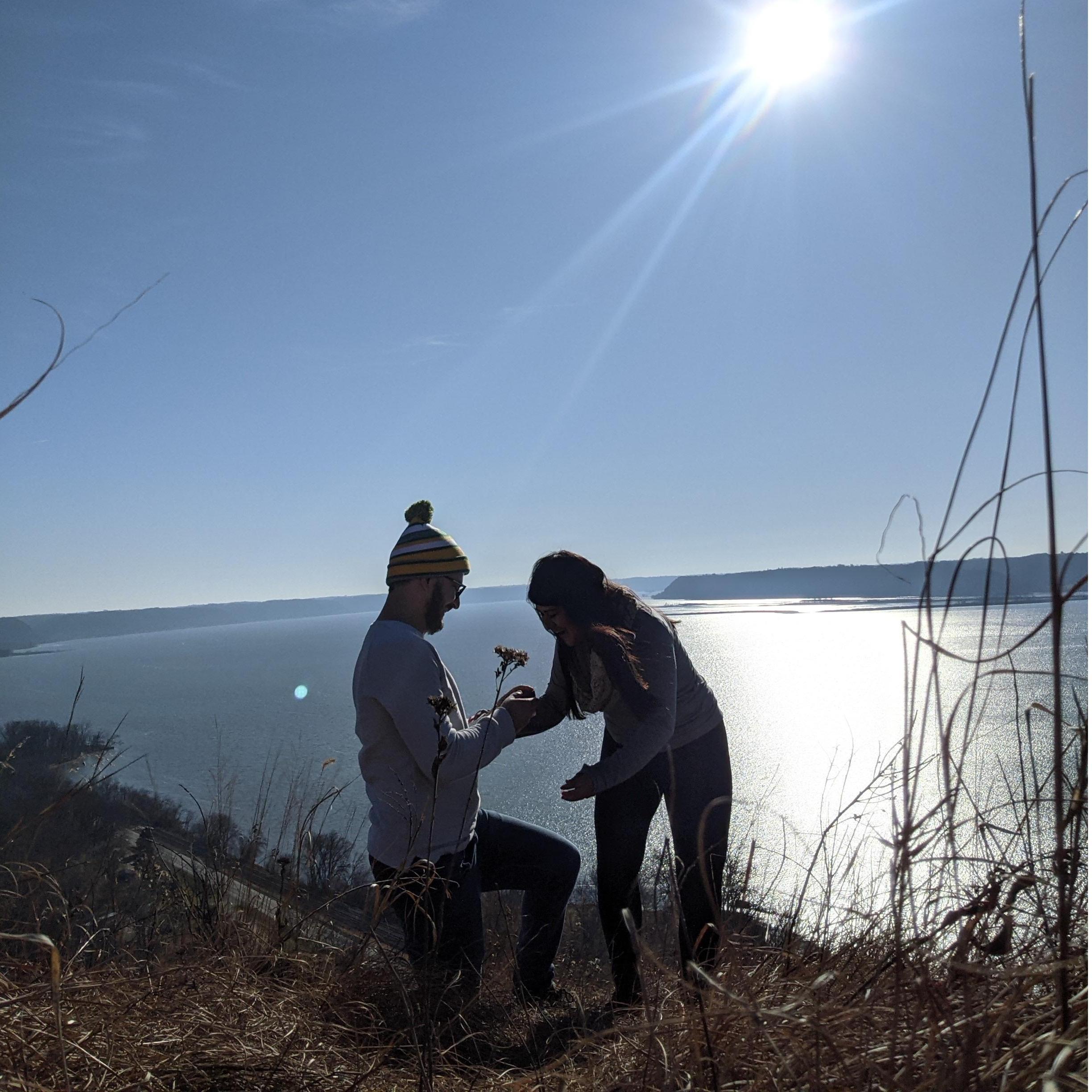 Joe proposed on a hike over looking the Mississippi River!