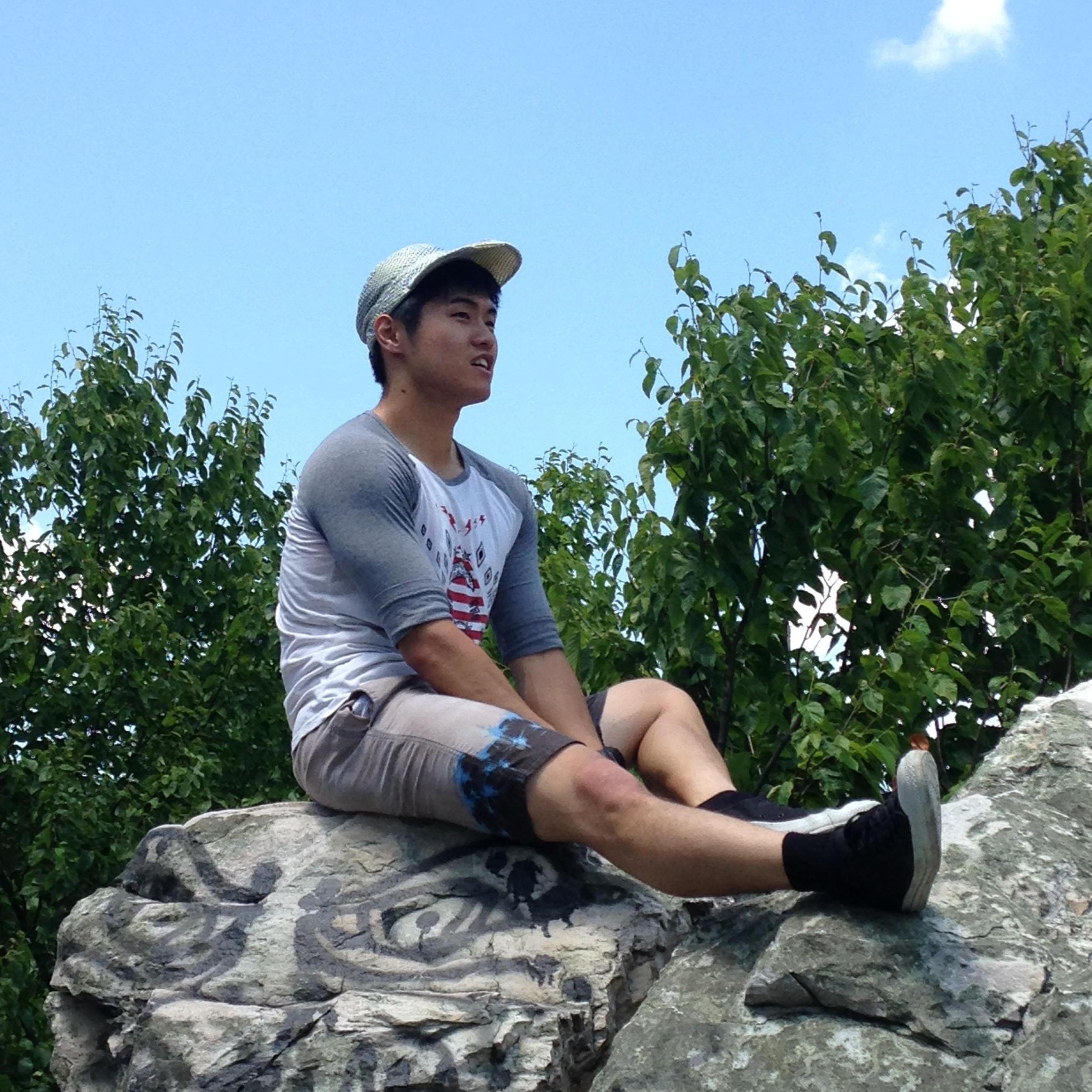 Yong: Chilling on a rock. He was looking around to see how high he'd climbed up. (2017 Harrisburg, PA)