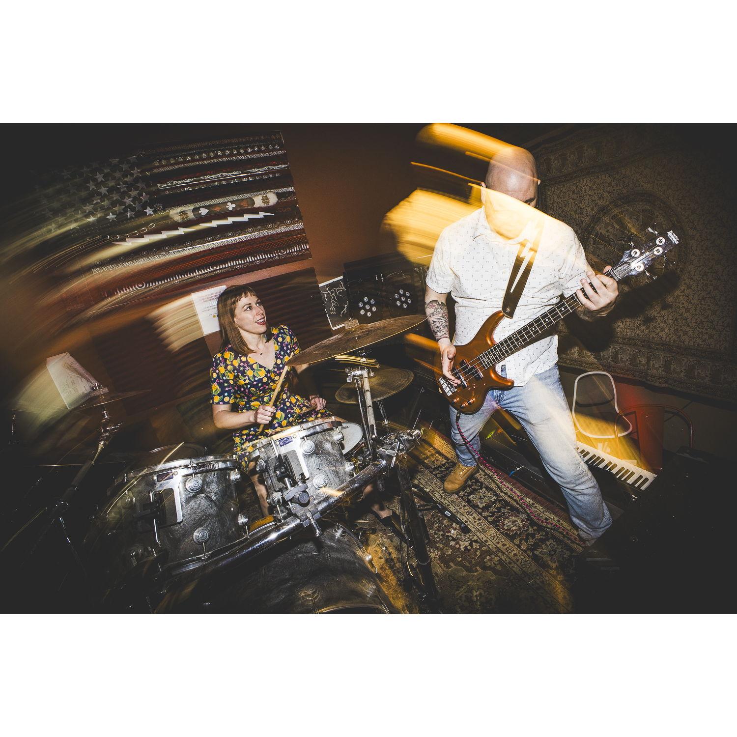 We love playing music together. Fun fact: Emily is responsible for Ait applying to his job at School of Rock!