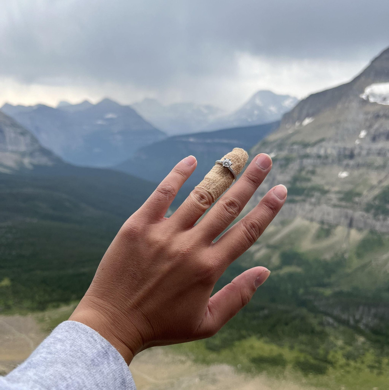 Wilber proposed on the side of Mount Siyeh in Glacier National Park. This is the only picture of the moment, as Tiffany had chopped off a piece of her ring finger a week before.