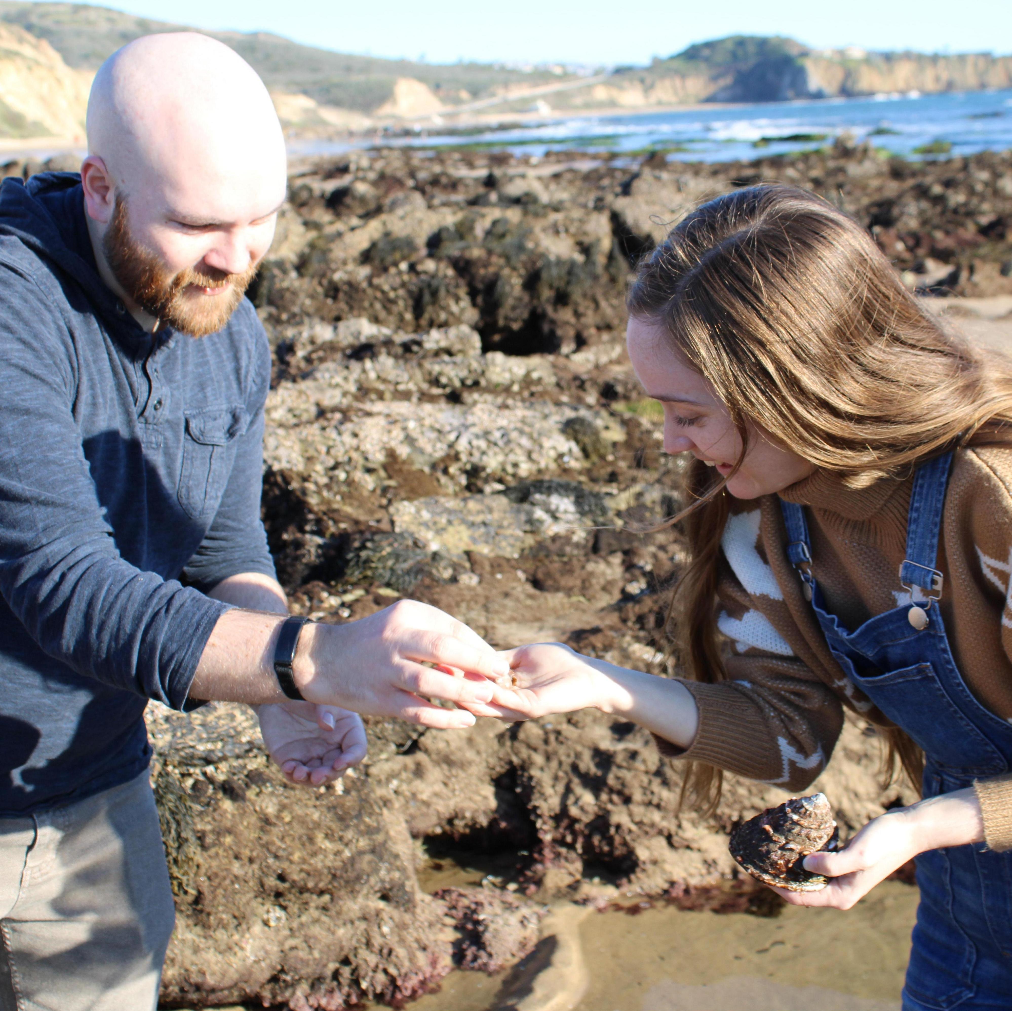 Just two nerds tidepooling and looking at shells with an immense affection. Photo by Ryan's coworker Rebekah!